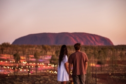 couple watching uluru sunset